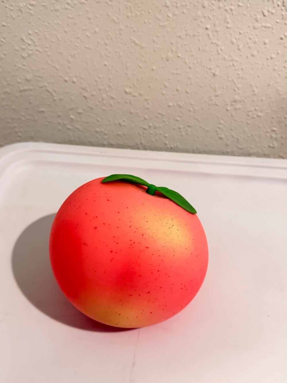 Peach Stress Ball with Green Leaf Top